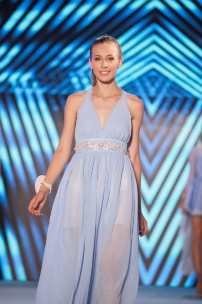 A chiffon dress with a tie around the neck with a crystal belt